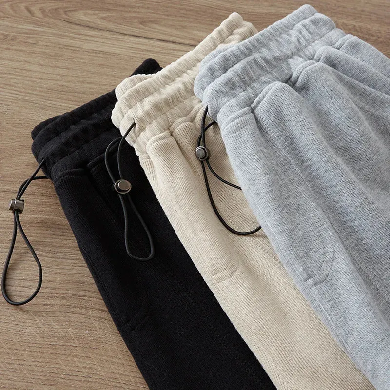 Adjustable Drawstring Men's Sweatpants: Casual Baggy Sports Trousers with Solid Color and Pockets