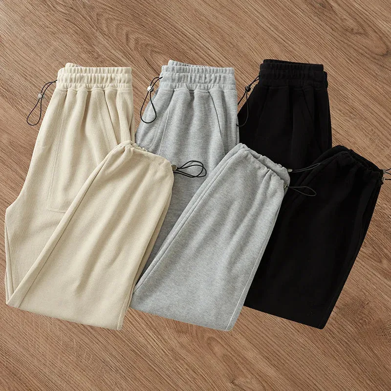 Adjustable Drawstring Men's Sweatpants: Casual Baggy Sports Trousers with Solid Color and Pockets