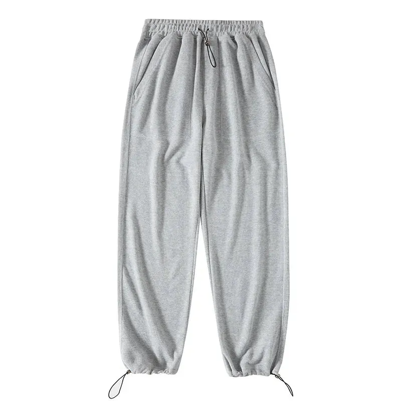 Adjustable Drawstring Men's Sweatpants: Casual Baggy Sports Trousers with Solid Color and Pockets