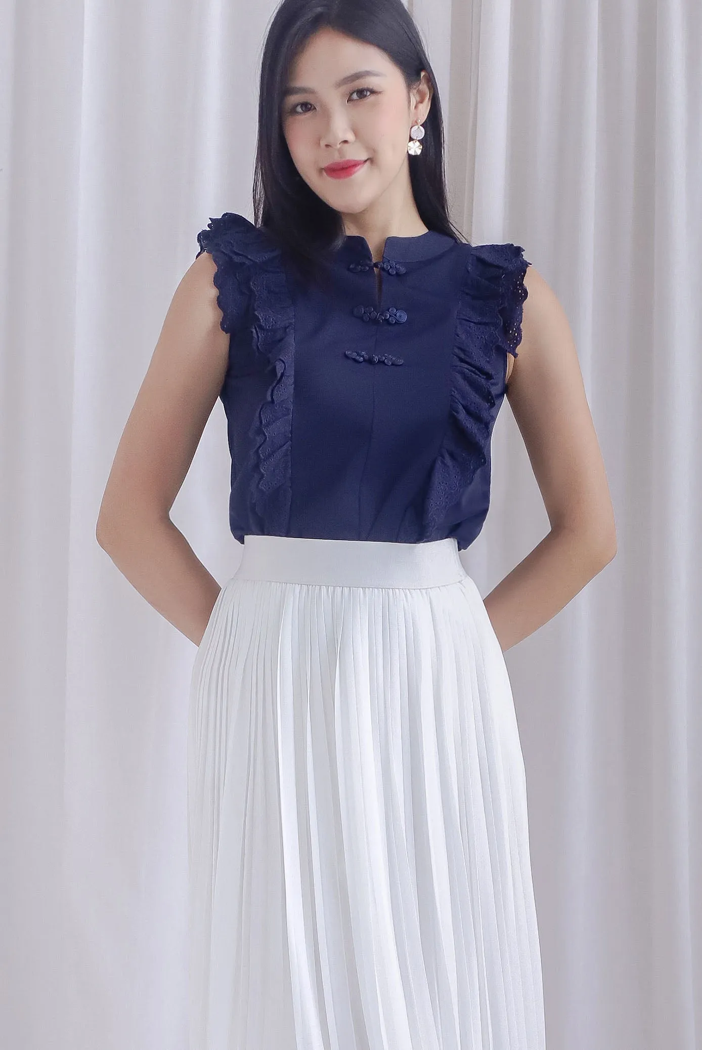 Ashlee Eyelet Flutter Oriental Collar Top In Navy Blue