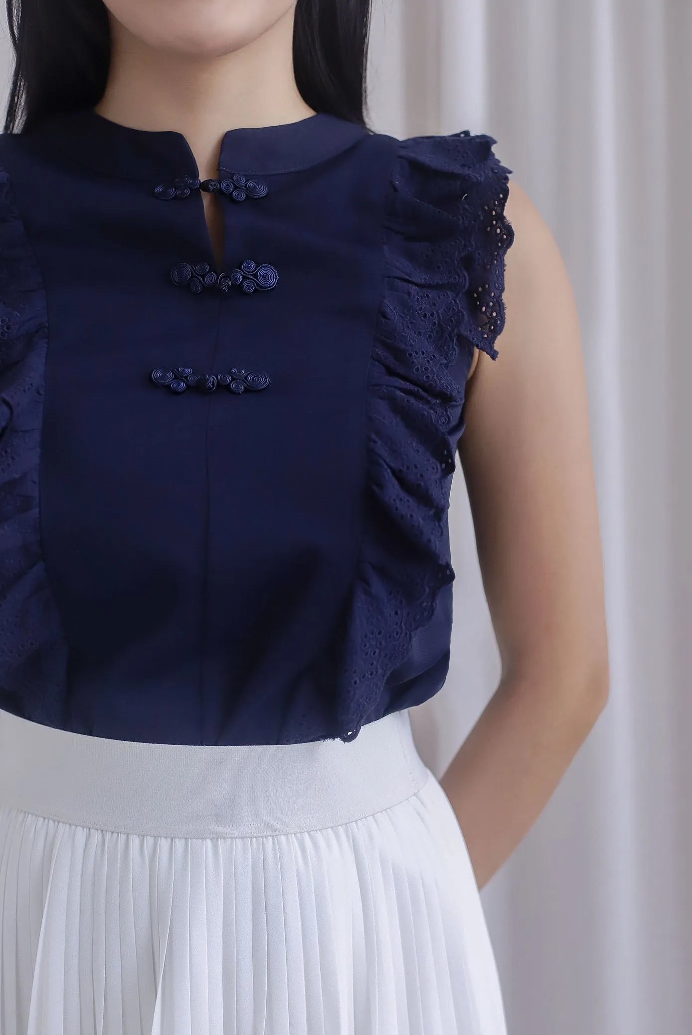 Ashlee Eyelet Flutter Oriental Collar Top In Navy Blue
