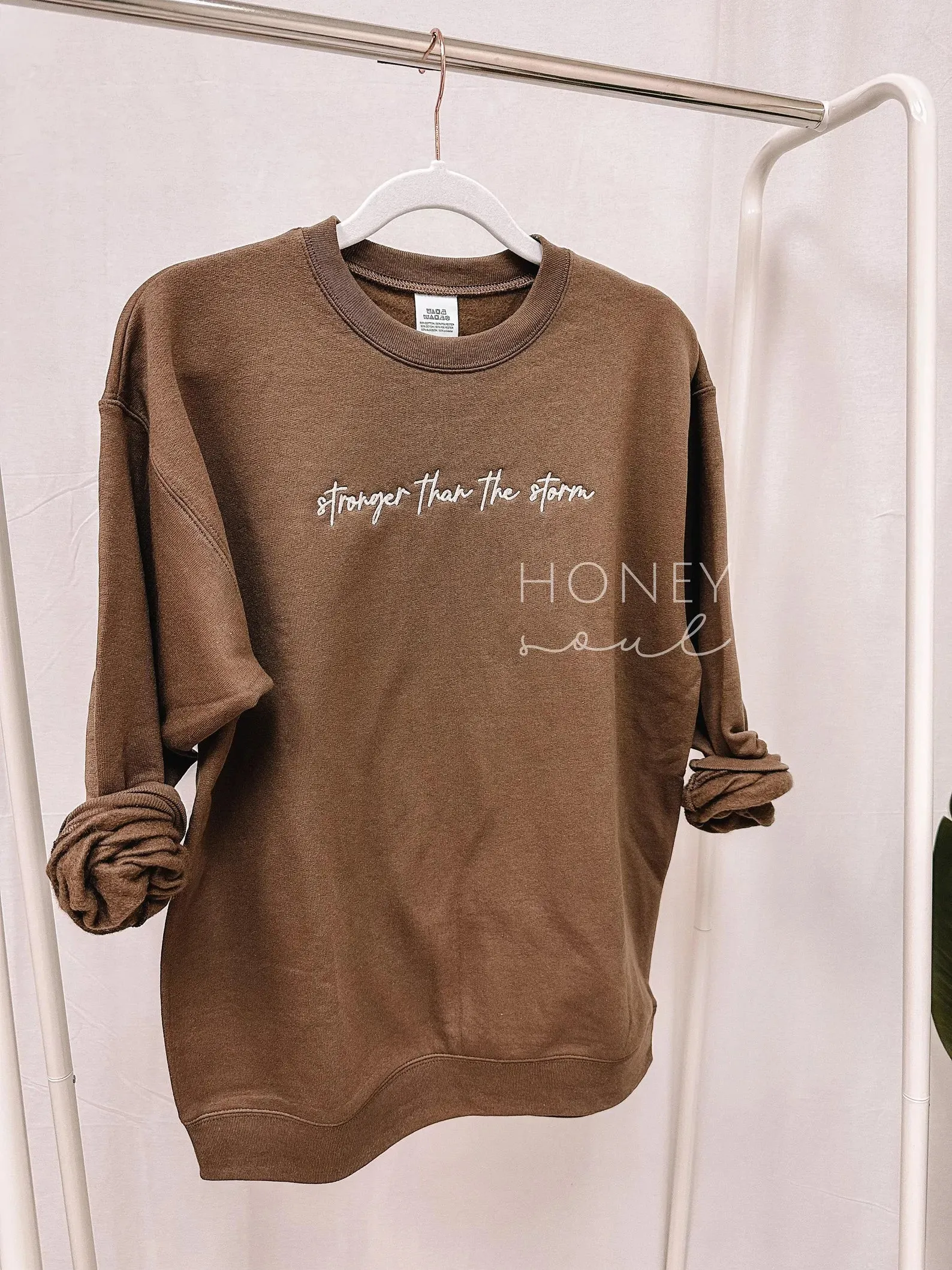 WOMEN'S STRONGER THAN THE STORM SWEATSHIRT